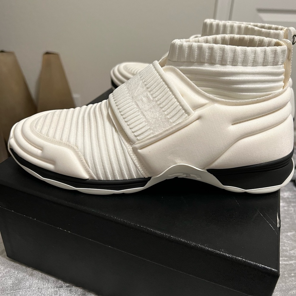 Ladies Chanel Sneaker off white in color size 9.5